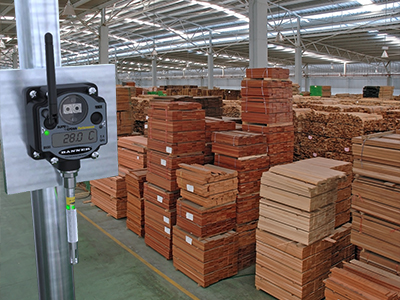 Lumber warehouse with a wireless sensor  that is monitoring temperature and humidity.