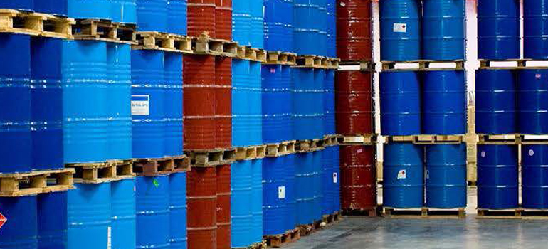 Stacks of metal drums containing chemicals
