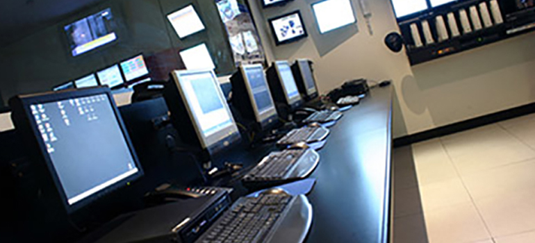 Row of computer equipment as an example of property assets that can be tracked using auto-id technology like RFID and Bluetooth Low-Energy.